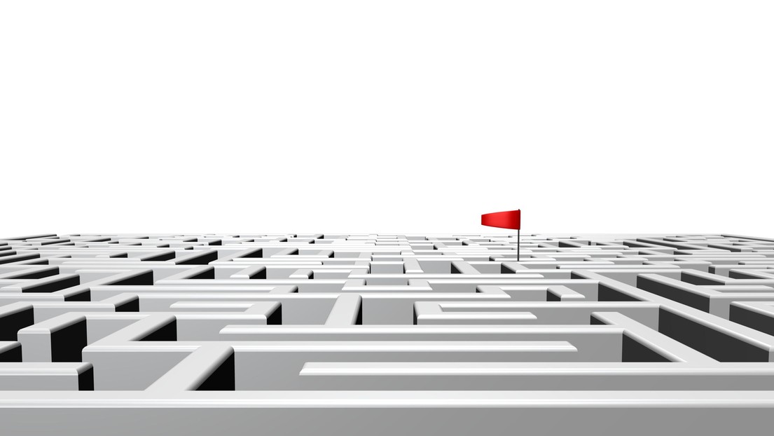 Complex maze with flag marking position © iStock / EPFL 2021