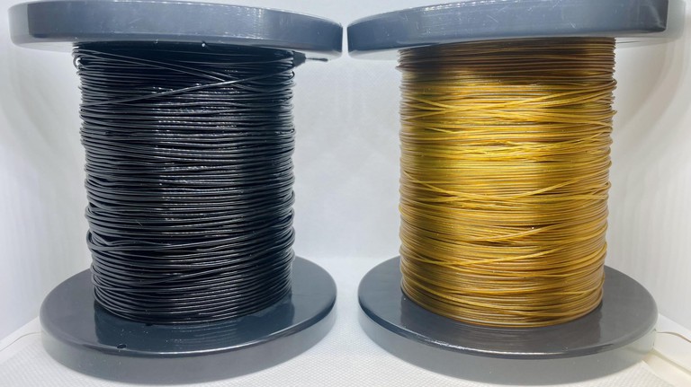 The dyed and natural polyamide fibers after extrusion. Credit: Lorenz Manker/EPFL