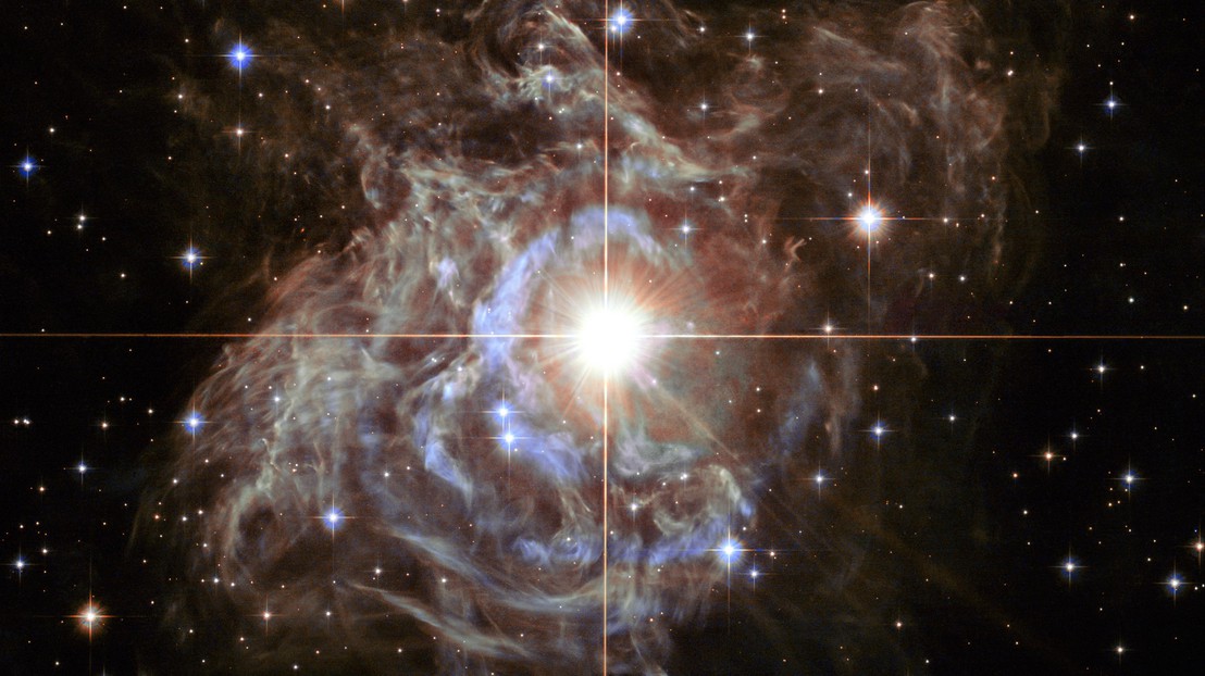 RS Puppis, one of the most luminous Cepheid variable stars, rhythmically brightens and dims over a six-week cycle. Credit: NASA, ESA, Hubble Heritage Team (STScI/AURA)-Hubble/Europe Collaboration.