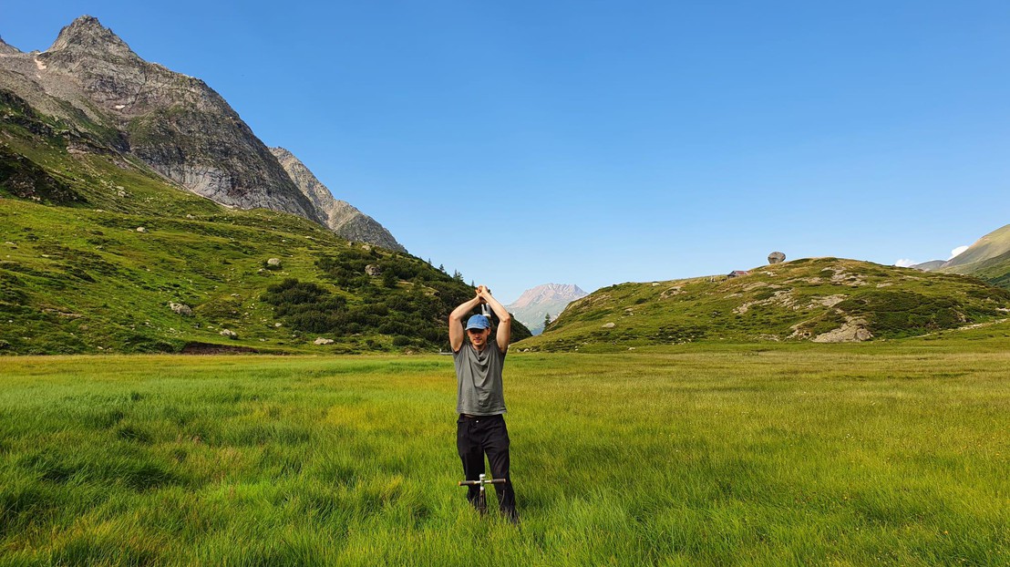 Gino taking a soil sample in Binntal © 2024 Bence Dienes