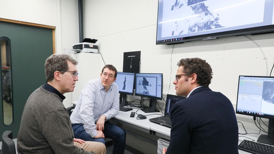 Pascal Turberg discussing results of scan with Mathieu Demierre (center) and Lionel Pernet of Cantonal Museum of Archaeology and History © 2019 EPFL