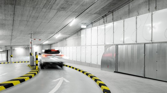 Enerdrape panels in use within a parking garage setting