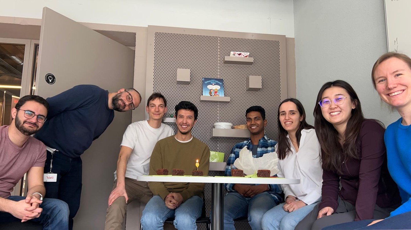 Left to right: Dylan, Filippo, Bence, Orly, Vineeth, Clara, Xinru, and Meret celebrating Orly's birthday © 2026 M. Aeppli