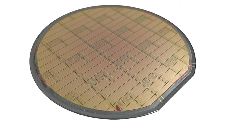 Photograph of a manufactured 100-mm wafer hosting hundreds of copper Damascene lithium tantalate modulators. Credit: Lin et al 2026. Photograph of a manufactured 100-mm wafer hosting hundreds of copper Damascene lithium tantalate modulators. Credit: Lin et al 2026.