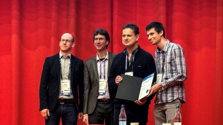 Martin Lentz (right) at SPIE Photonics Europe in Strasbourg, France. 2026 EPFL CC BY SA