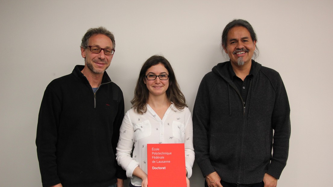 © 2017 EPFL. Gülcan standing between her thesis directors.