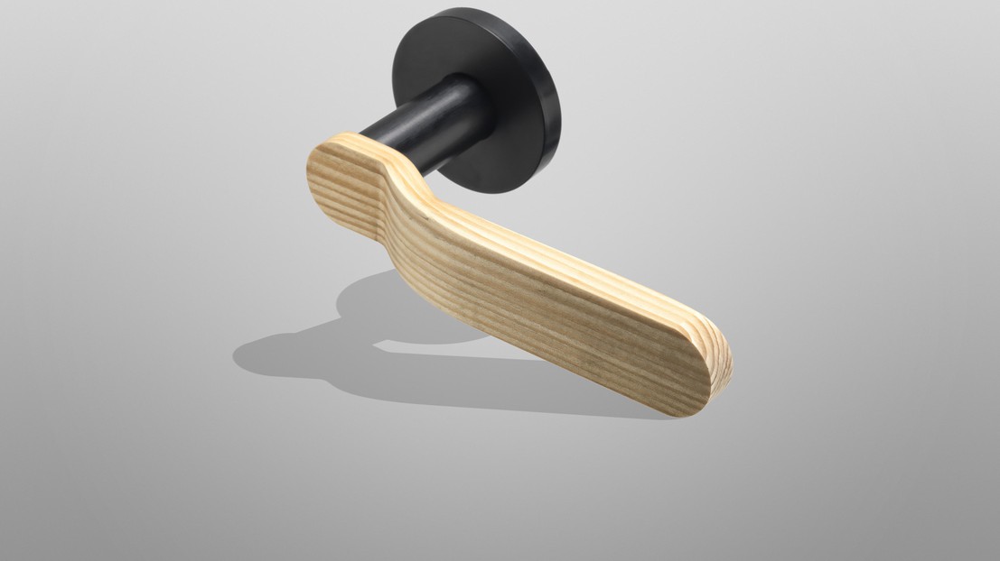 A new world opens for pinewood, here is a door handle made out of the compressed wood. ©EPFL+ECAL