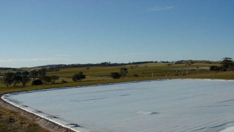 Or by a tarp. But these solutions don't adapt to the changing size and shape of the ponds.