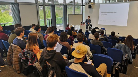 Julien Perrochet gives a talk on networking in a competitive market. © 2019 CLIC/EPFL