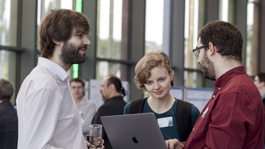 Smiles and conversations during the poster session. © 2019 Samuel Devantéry