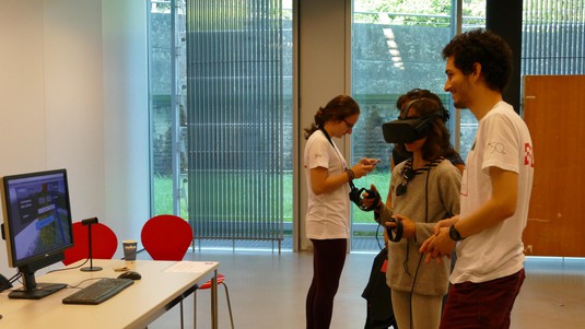 Visitor Clara tries the CHILI lab’s VR-based educational tool for garden design © 2019 EPFL