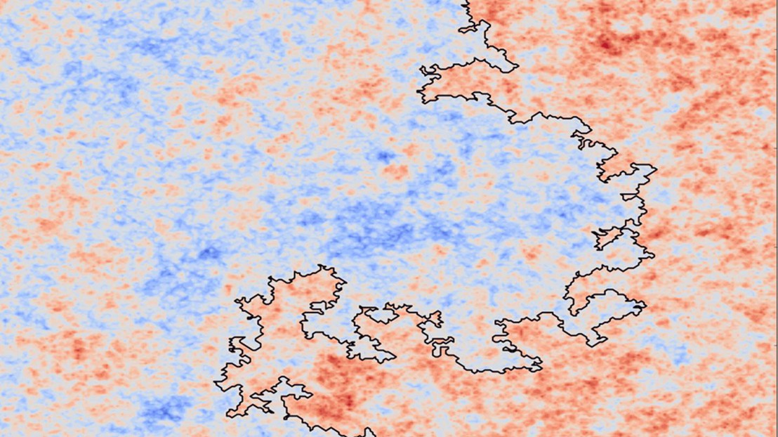 A heat map of the heights of an approximation of the 2D GFF (red is high, blue is low) together with a zero contour line, drawn in black. Credit: Juhan Aru, EPFL