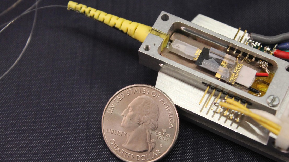 Compact silicon-nitride integrated soliton microcomb chip device in a butterfly package with a fiber output. Credit: Lin Chang (UCSB)