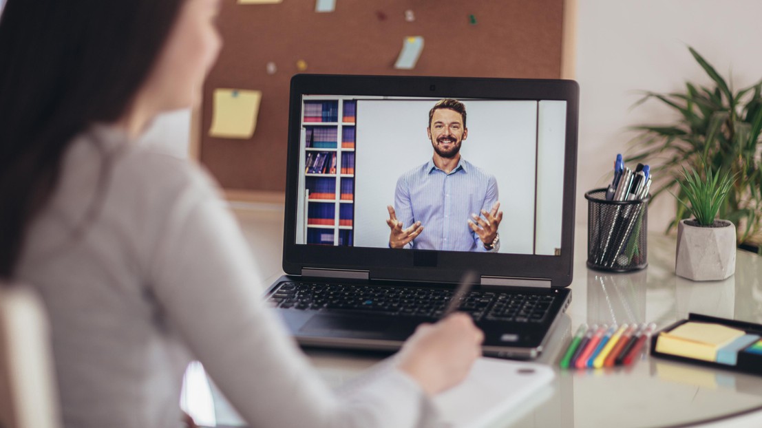 Young student watching lesson online © Jovanmandic - Istock